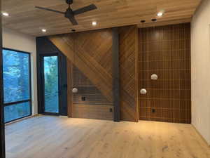 Empty room featuring wood ceiling, recessed lighting, wood-type flooring, and ceiling fan