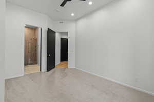 Unfurnished bedroom featuring carpet flooring, a ceiling fan, recessed lighting, and ensuite bathroom