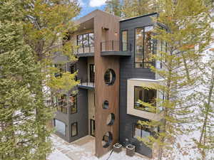 View of front of home featuring a balcony