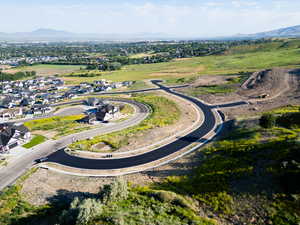 Aerial perspective of suburban area with a mountain backdrop
