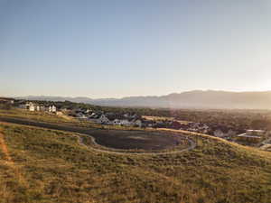 View of mountain backdrop featuring nearby suburban area