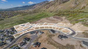 Aerial overview of property's location featuring property parcel outlined and a mountainous background