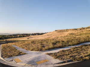 View of yard with a mountain view and a rural view