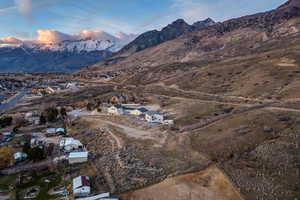 Aerial view of property's location with a mountainous background
