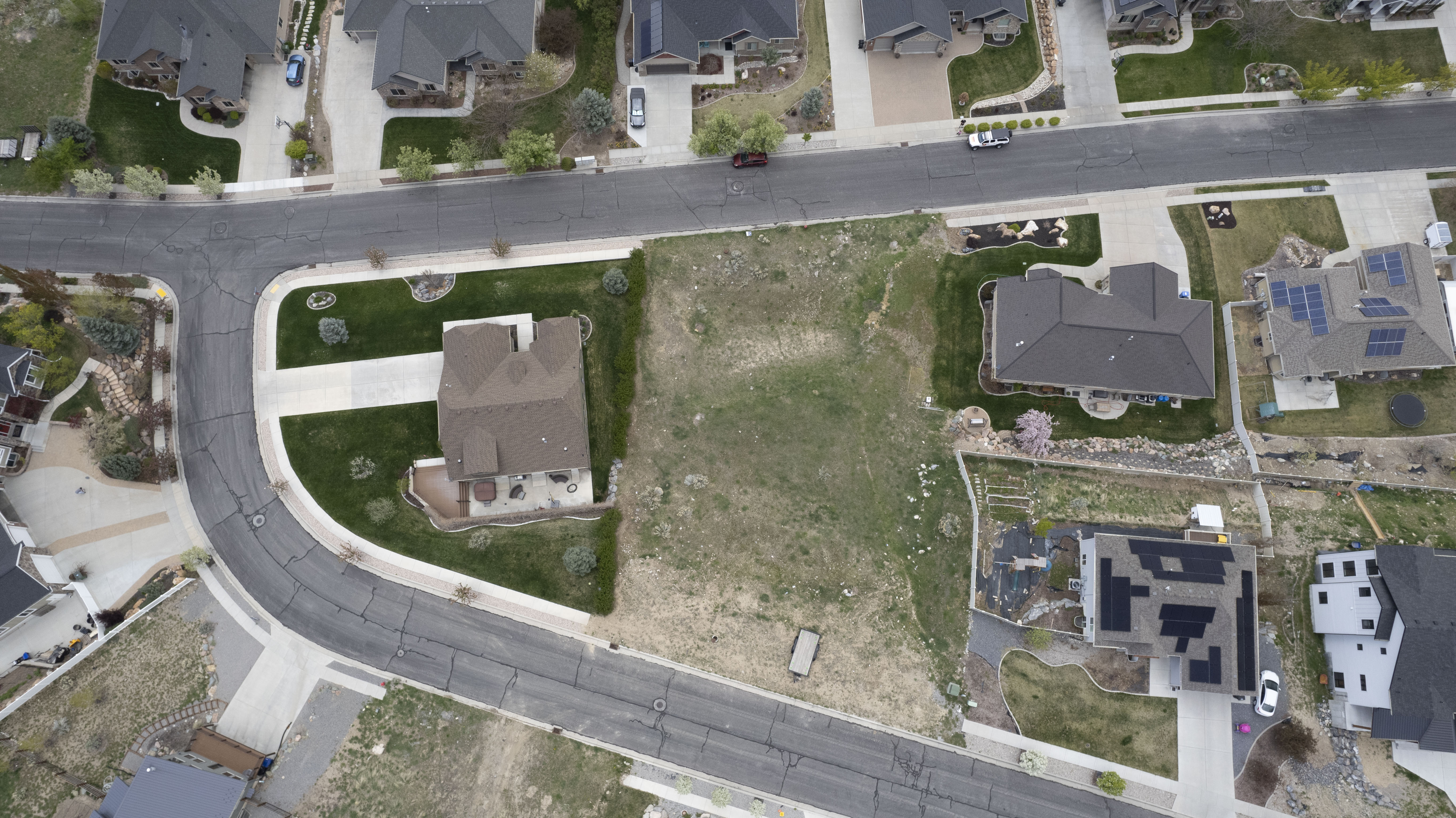 Aerial overview of property's location featuring nearby suburban area.  Notice there are two accesses  into this lot.
