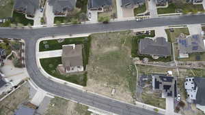 Aerial overview of property's location featuring nearby suburban area.  Notice there are two accesses  into this lot.