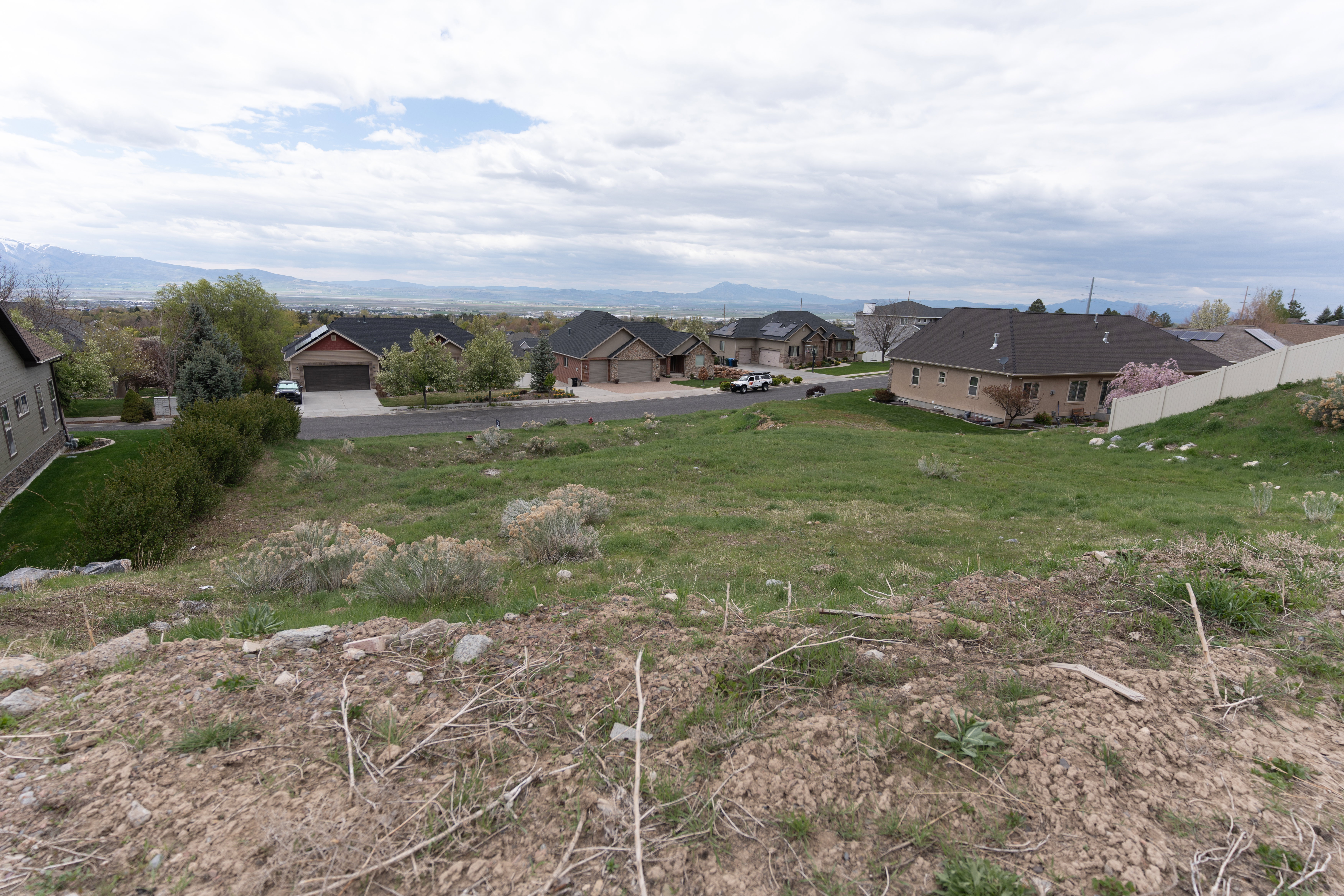 View of yard with a residential view and a mountain view this view is looking to the WEST