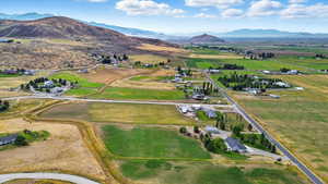 View of property location featuring mountains and rural landscape