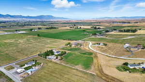 Aerial view of property's location with a mountain backdrop and rural landscape