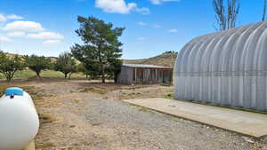 View of outbuilding with a mountain view