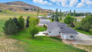 Aerial view of property and surrounding area with mountains