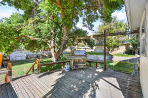 Deck with a storage unit and grilling area
