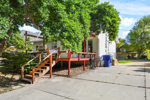View of patio / terrace featuring stairway and a deck