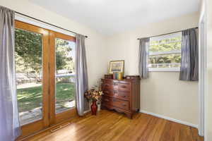 Entryway featuring hardwood / wood-style flooring and baseboards