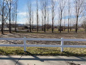 View of yard featuring a view of countryside and a mountain view