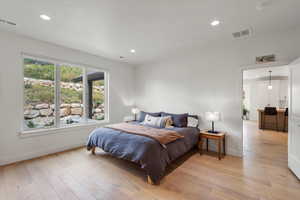 Bedroom featuring light wood finished floors and recessed lighting