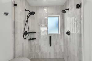 Bathroom featuring a shower stall