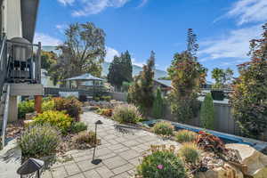 Fenced backyard featuring a patio area