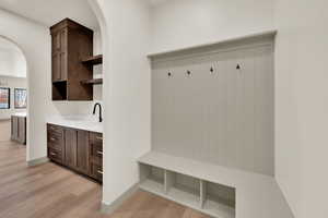 Mud room with view of butler's pantry.