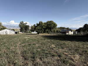 View of yard featuring a mountain view and a view of rural / pastoral area