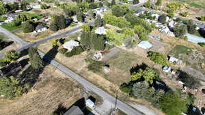 Aerial view of property's location with nearby suburban area