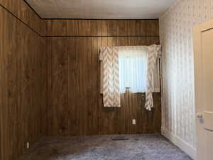 Empty room featuring carpet floors