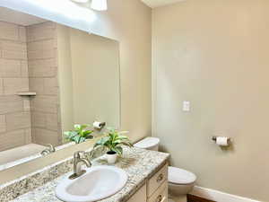 Full bath featuring vanity and shower / bathtub combination