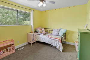 Bedroom featuring carpet floors and ceiling fan