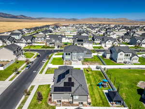 Aerial perspective of suburban area with a mountainous background