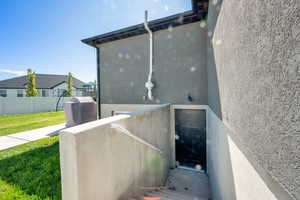 View of side of home with stucco siding