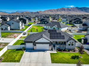 Aerial perspective of suburban area featuring a mountain backdrop