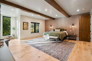 Bedroom with recessed lighting, beamed ceiling, and light wood-type flooring