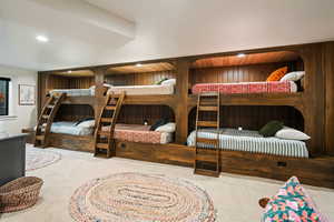 Carpeted bedroom with recessed lighting