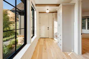 Doorway to outside featuring wood finished floors