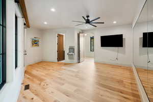 Unfurnished living room with light wood-style floors, recessed lighting, and ceiling fan