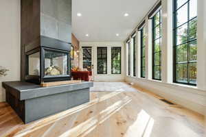 Unfurnished living room with recessed lighting and light wood-style floors
