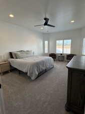 Carpeted bedroom with recessed lighting, a textured ceiling, and ceiling fan