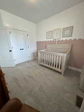 Bedroom with carpet floors and a closet