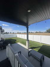 Fenced backyard featuring a patio