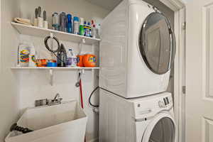 Washroom featuring estacked washer and dryer