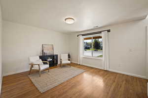 Living area with wood finished floors