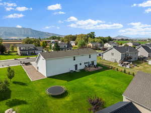 Aerial view of residential area featuring a mountain backdrop