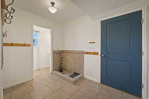 Bathroom featuring tile patterned floors and baseboards