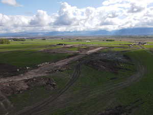 Overview of rural landscape featuring a mountain backdrop