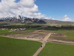 View of mountain backdrop with rural landscape