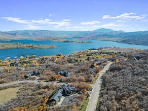 Aerial view of residential area featuring a water and mountain view
