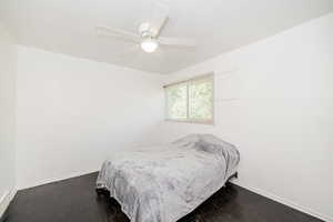 Bedroom featuring dark wood finished floors and ceiling fan