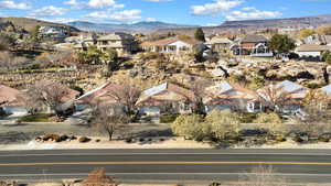 Aerial perspective of suburban area featuring a mountain backdrop