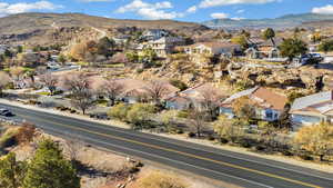 View of property location featuring nearby suburban area and mountains