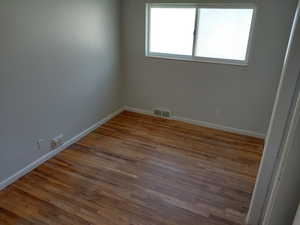 Bedroom 1,featuring light wood finished floors